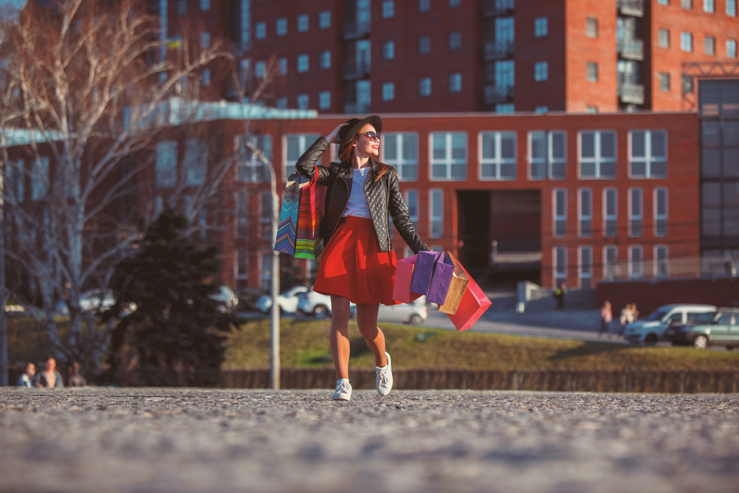 The girl walking with shopping on city streets