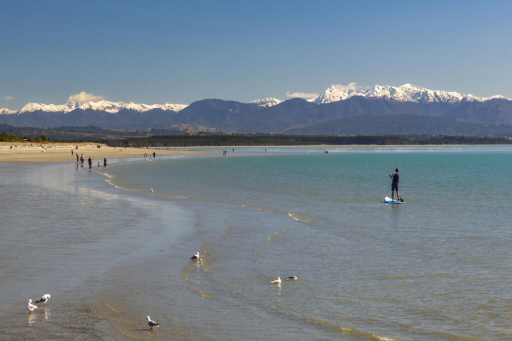 Winter paddleboarding at Tahunanui beach